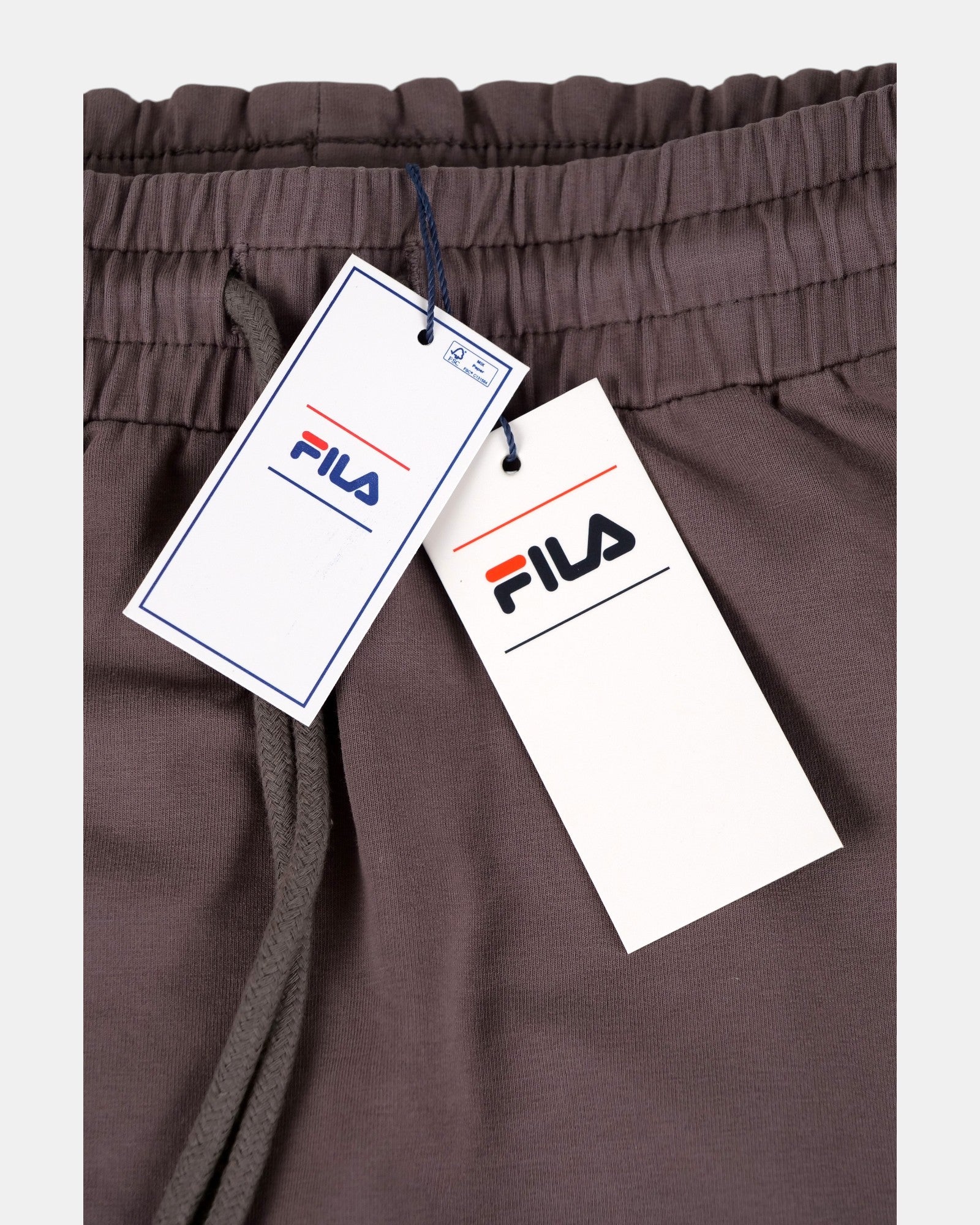 Gonna midi Fila CEVIRA in jersey di cotone elasticizzato color sparrow, con vita elasticizzata e coulisse, tasche laterali e logo ricamato.