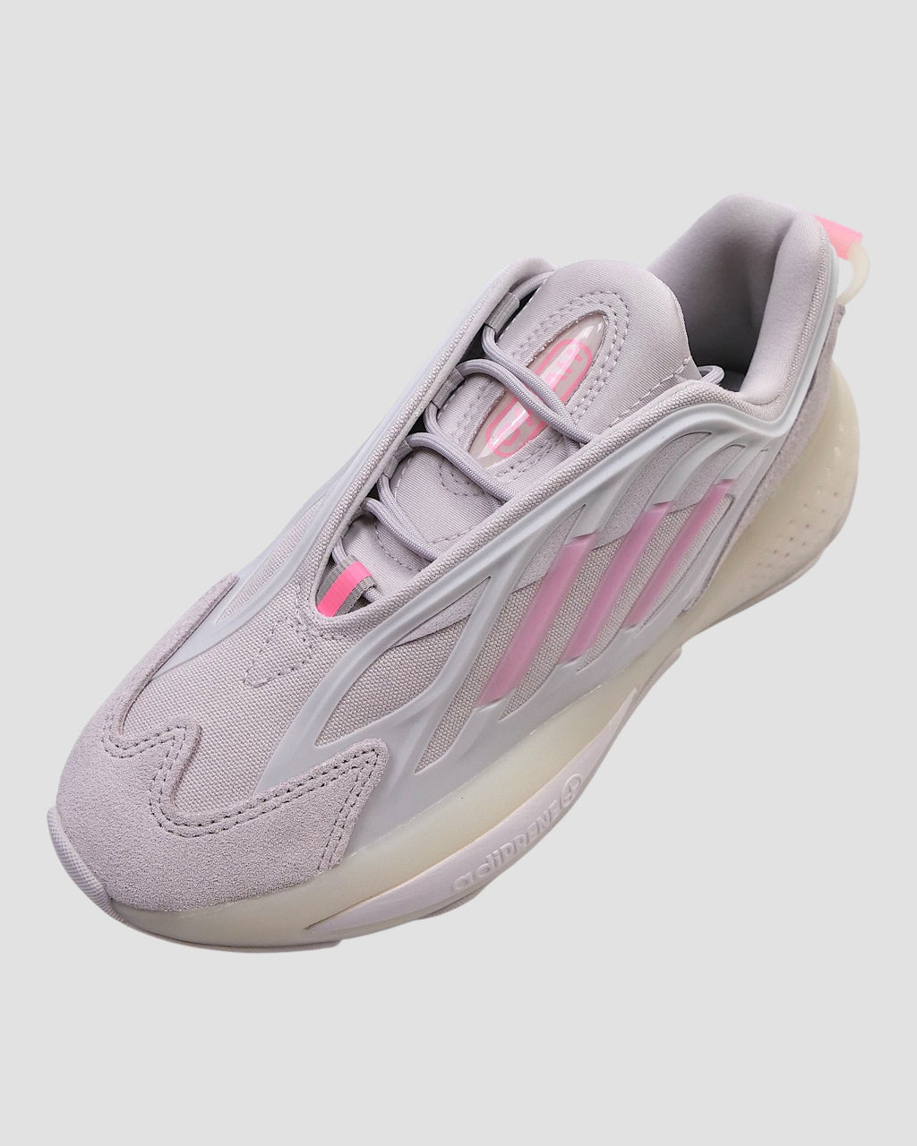 ULTIMATAGLIA.COM Sneakers Adidas Originals OZRAH J grigie con dettagli rosa e suola chunky. Design futuristico in mesh tecnico.