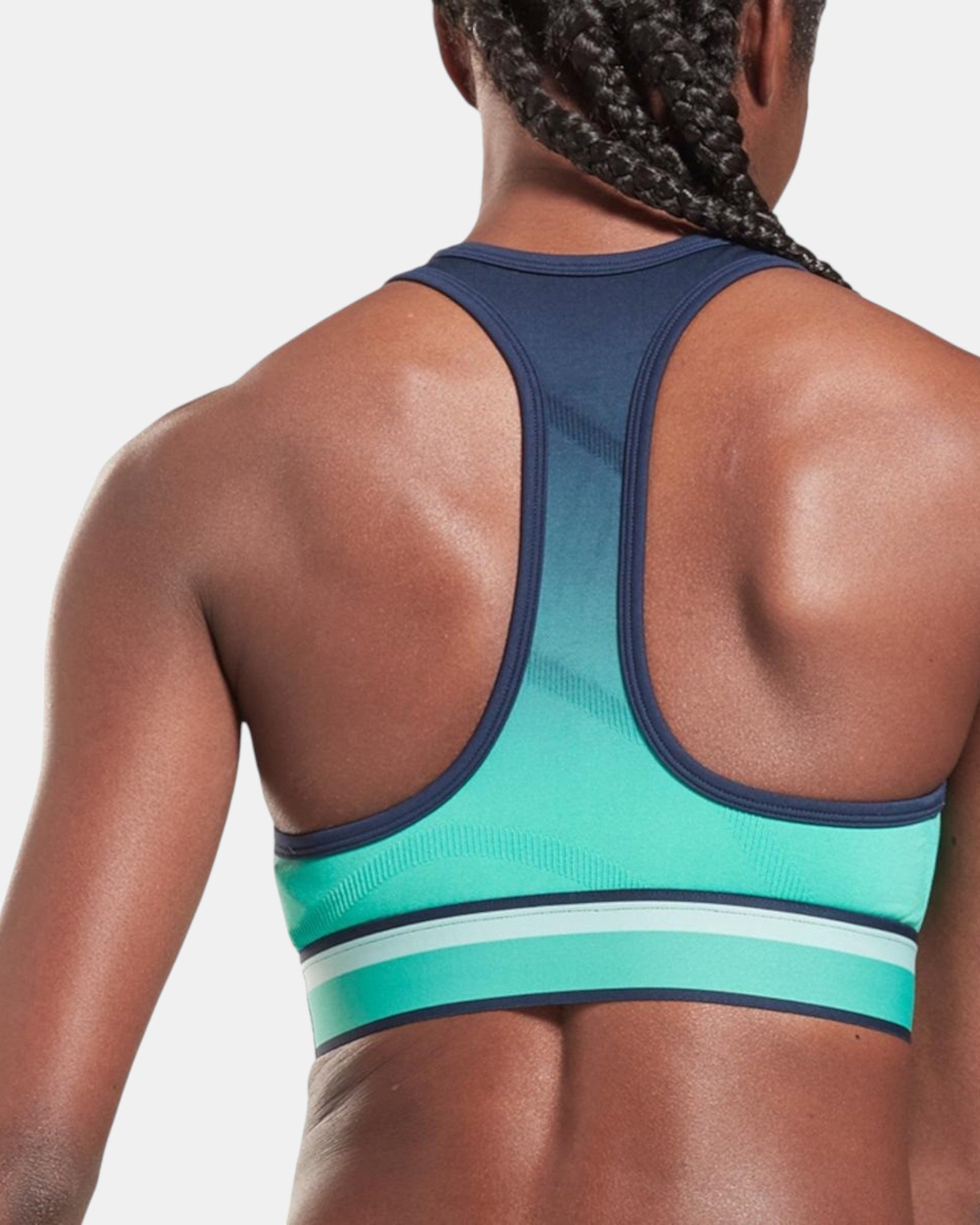 Reebok TS UBF Seamless Crop top con gradiente nero-turchese, logo Reebok, senza cuciture, taglio crop, per allenamento e athleisure.