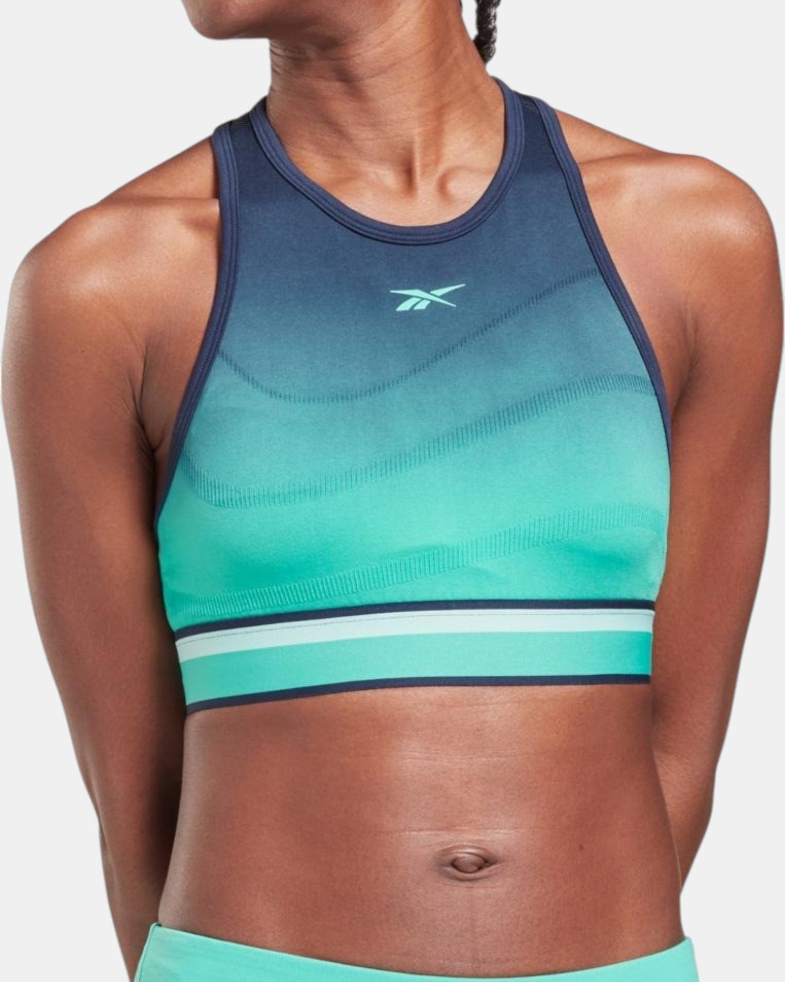 Reebok TS UBF Seamless Crop top in gradient black to bright turquoise, seamless fabric, racerback, logo on chest.