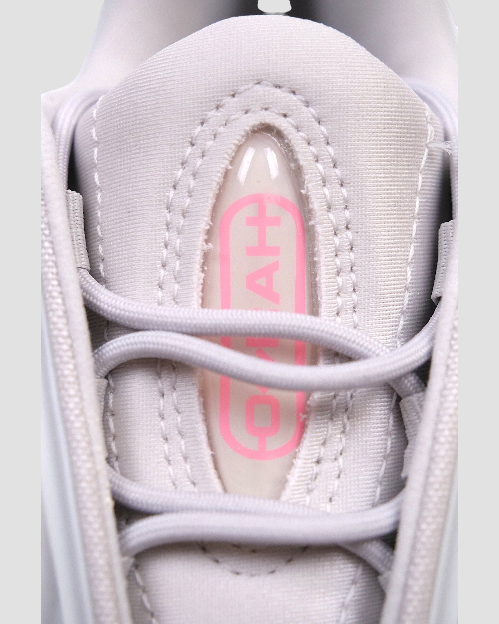 ULTIMATAGLIA.COM white mesh sneakers with pink OZRAH J logo detail and silver accents.